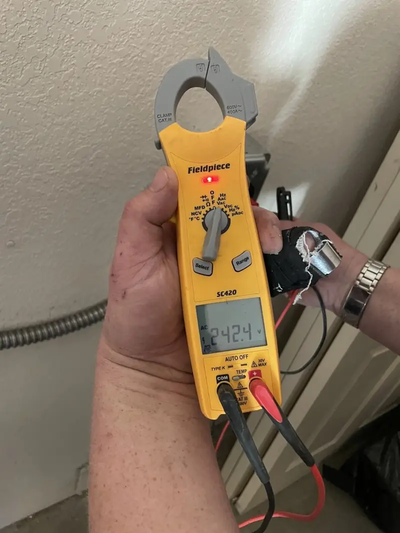 Voltage testing with clamp meter during Ceiling Fan Installation in Morehead City